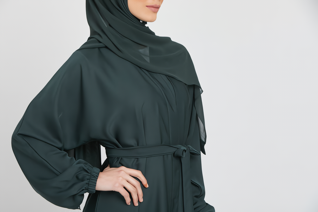 Close-up zoom on chest design of green kimono abaya layered with white slip dress, stylish modest wear abaya for women