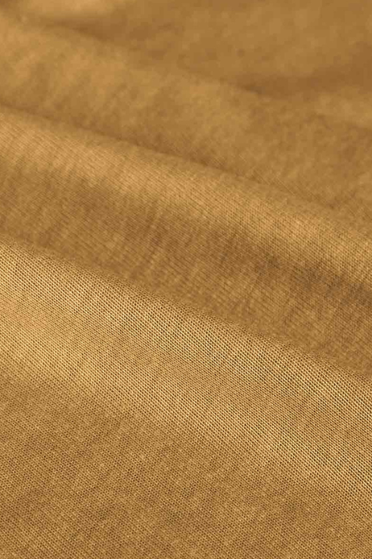 Close-up of brown fabric with visible texture