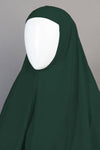 Dark green hijab on a mannequin against a gray background