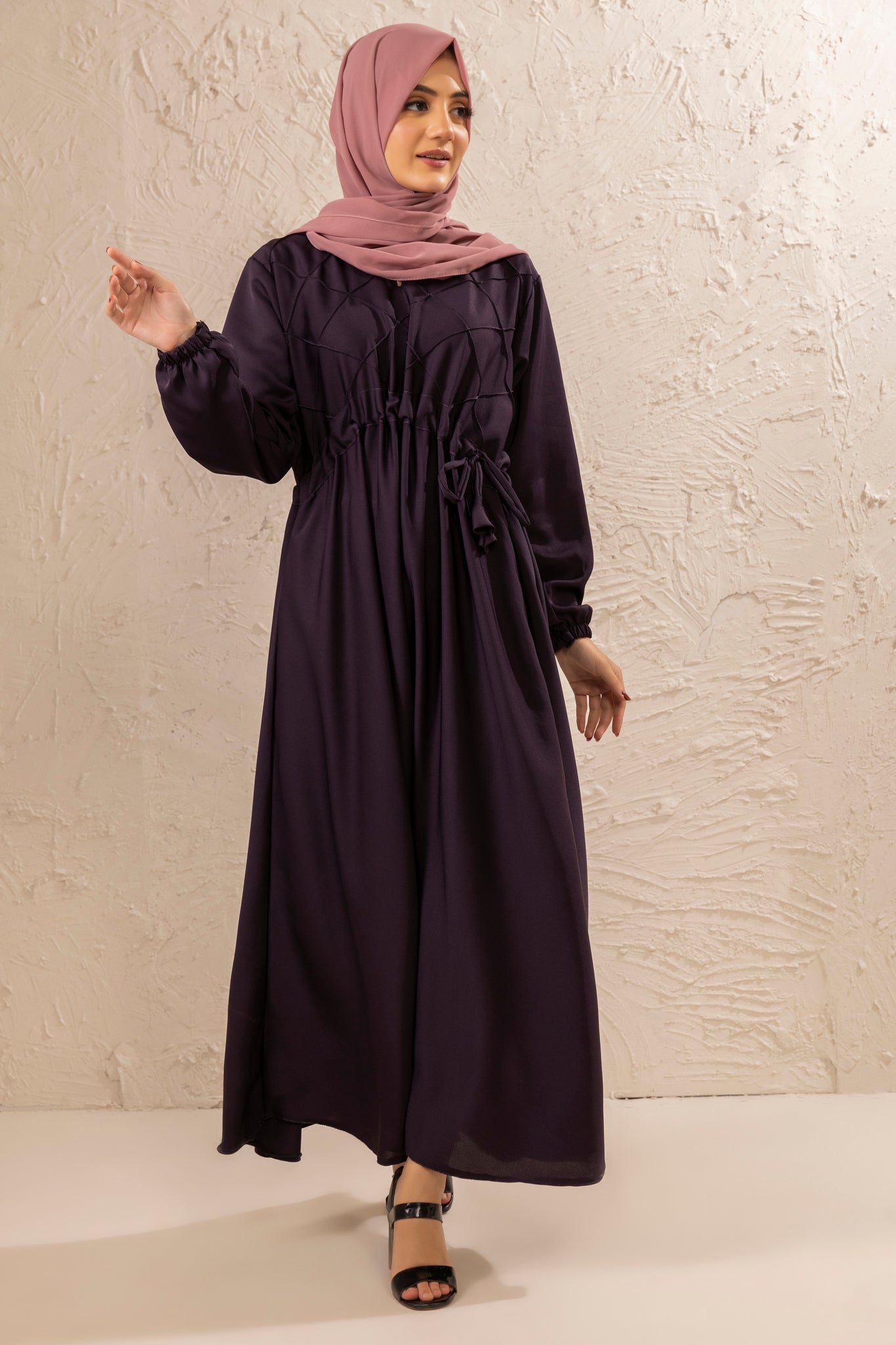 Front full view of half pintex abaya with belted waist design and elastic cuff sleeves, simple modest abaya dress