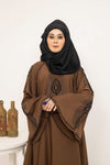 Close-up of nug and moti embellishment design on abaya front, stylish modest wear abaya for women in Pakistan