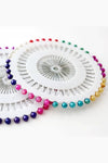 Close-up view of Premium Hijab Pin Wheel featuring 40 multi color hijab pins, durable tempered steel with nickel coating by Abaya for Women.