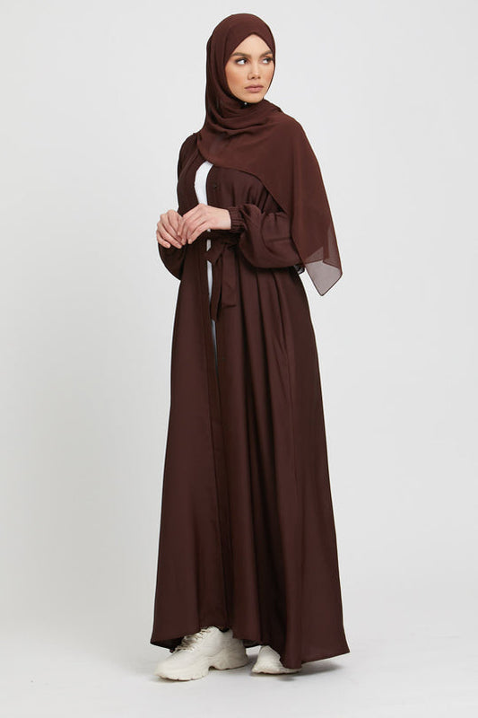 Front full view of stylish brown kimono abaya paired with white slip dress, modest abaya outfit with cuff design for women