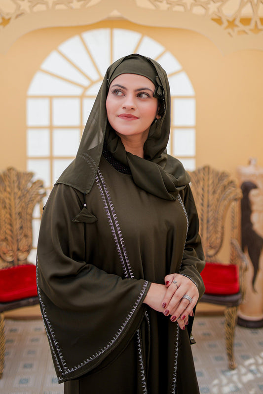 Close-up of nug work design on the front of white abaya, stylish abaya for women, modest fashion Pakistan