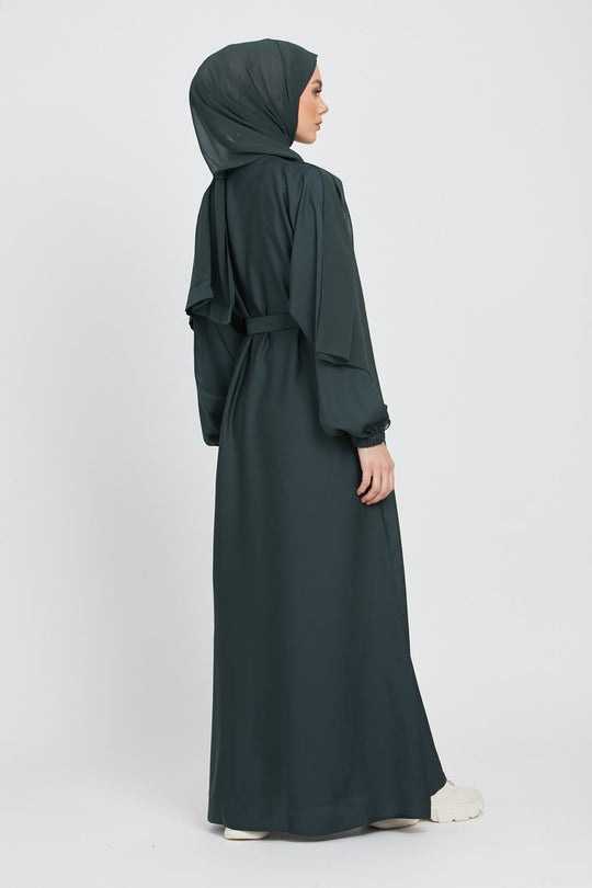 Back side full view of green kimono abaya with white inner slip dress, elegant modest fashion abaya for women in Pakistan