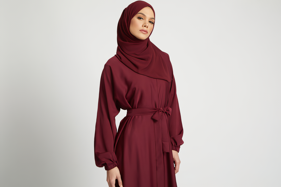 Zoomed-in detail of waist belt on red kimono abaya with elastic sleeves, stylish modest abaya fashion