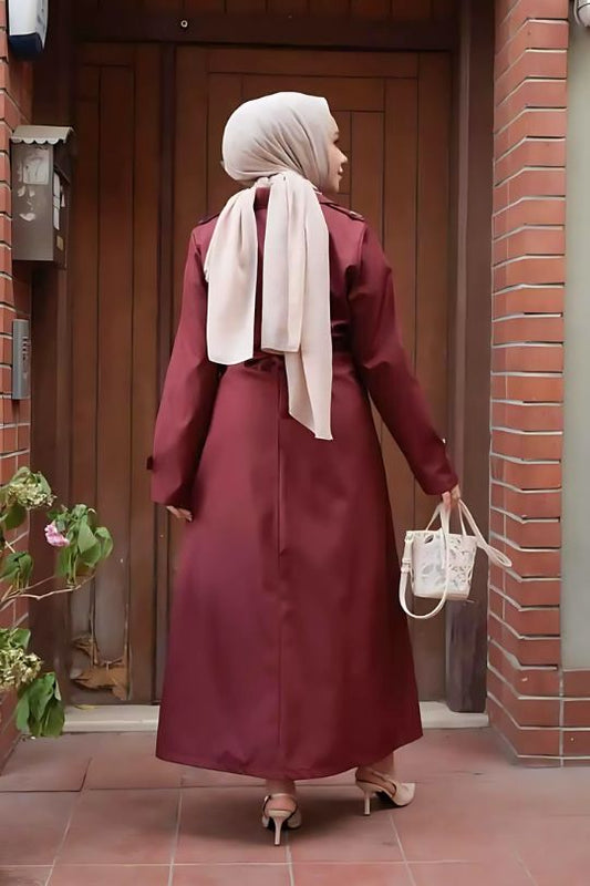 Back view of claret red trench coat abaya highlighting modest and flowy design