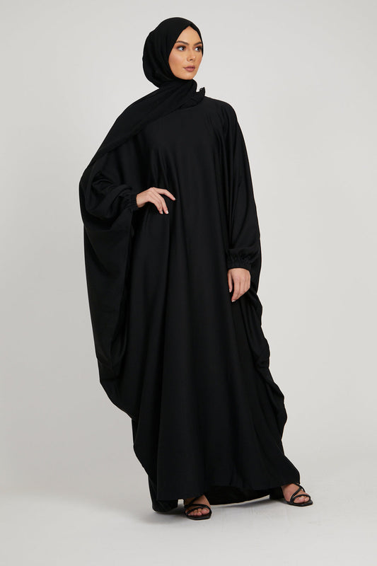 Stylish front view of black kaftan abaya with cuff design, modest abaya dress for women online in Pakistan