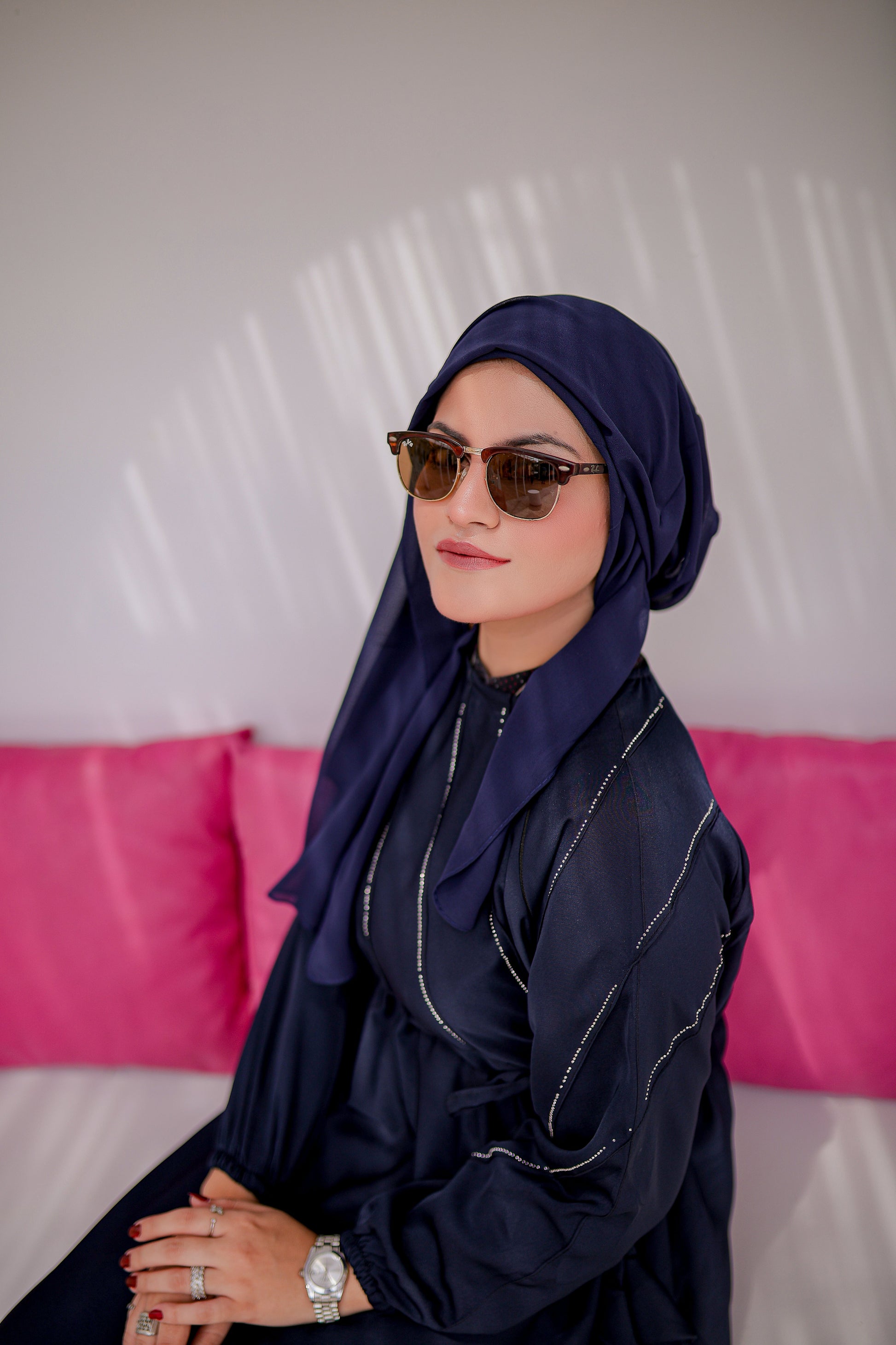 Zoom-in showing fabric texture and pintax sleeve detailing on navy blue abaya, elegant modest abaya for women in Pakistan