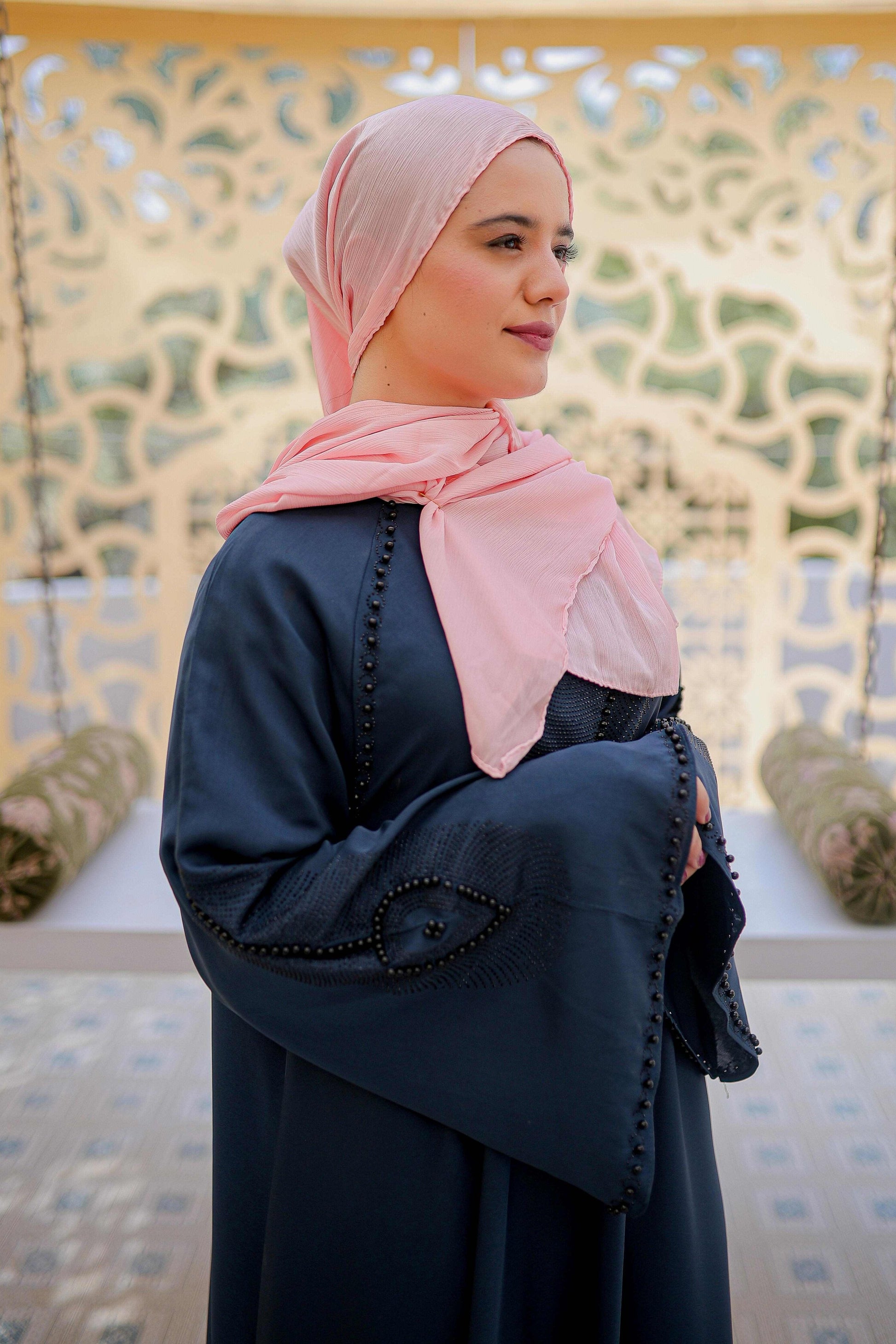 Close-up of delicate nug and moti work embellishment on abaya neckline, stylish abaya design for women in Pakistan