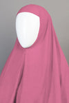 Pink hijab on a mannequin with a gray background