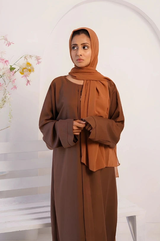 Zoom in view of Premium Nida Fabric Plain Abaya in luxurious brown highlighting modest full-length fit