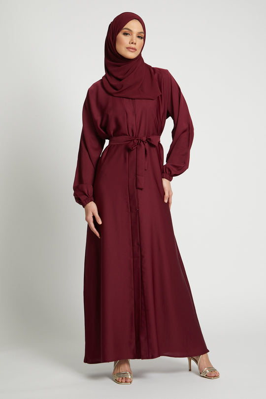 Elegant red kimono abaya with belted waist and long sleeves, modern modest wear for women