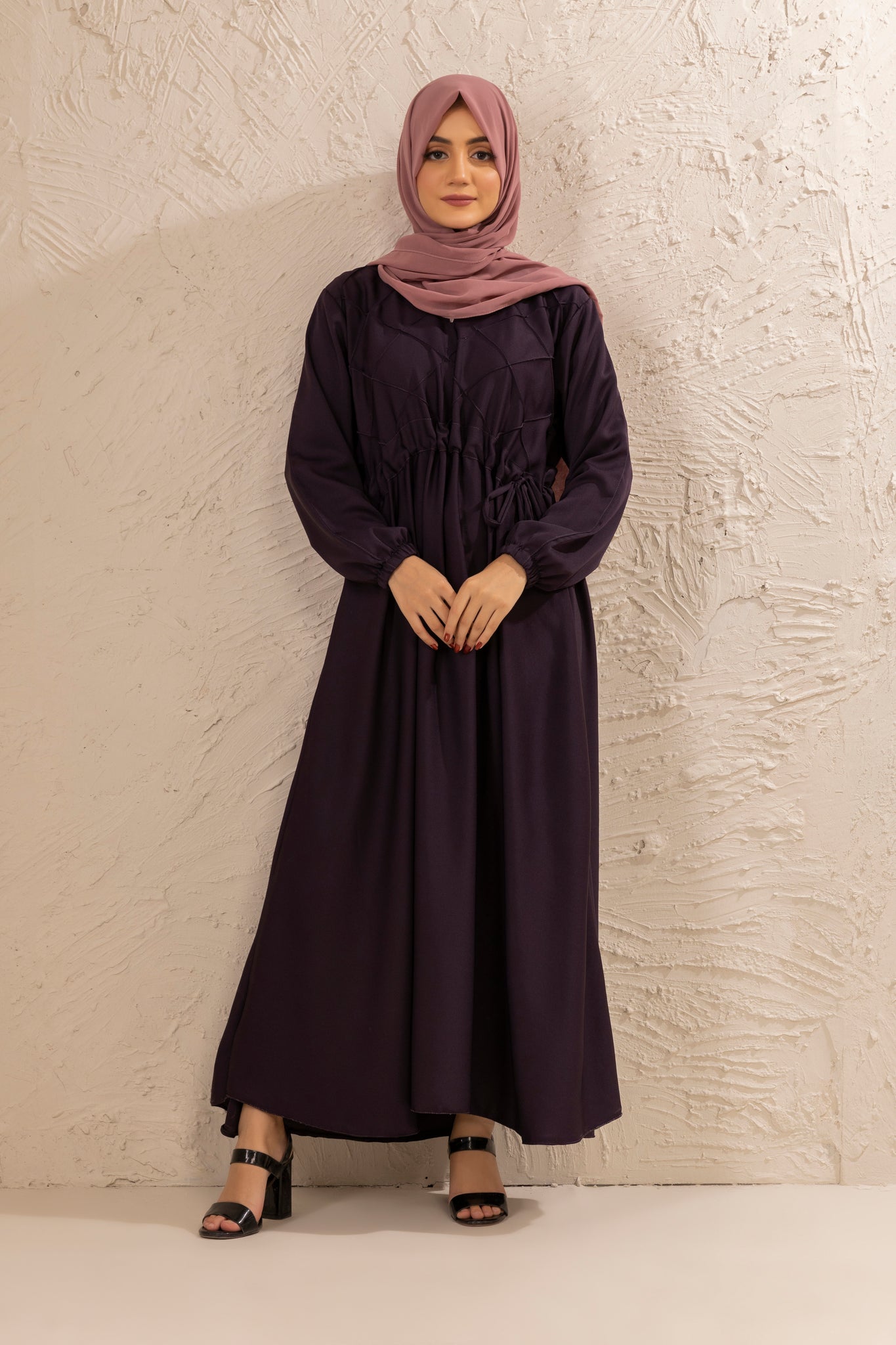 Front view of modest half pintex abaya designed with belted waist and cuffed sleeves, Islamic dress for women in Pakistan