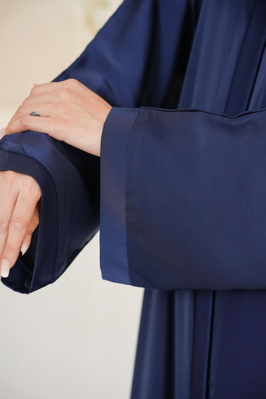 Close-up front zoom showing TikTok crinkle Nida fabric texture on plain front open abaya for women