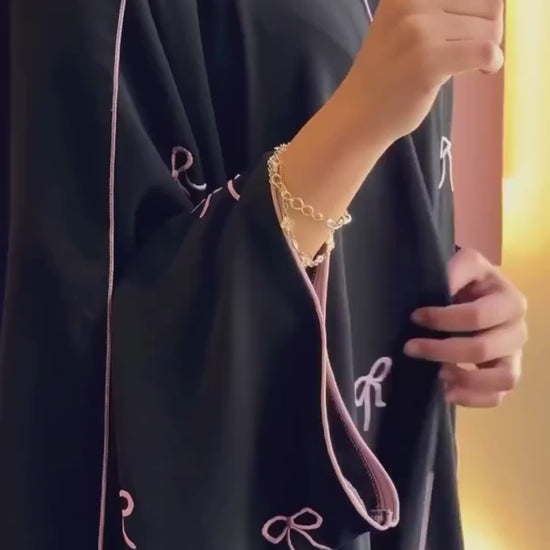 Video of Luxe Bow Abaya showing front, side, and back angles with bow detail for women’s modest fashion